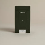 Dark green box labeled ‘FORGRAVE Fine Tea Leaves and Tisanes, 002 Black Blend Bright Side on a beige background.