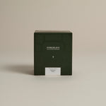 Dark green box labeled ‘FORGRAVE Fine Tea Leaves and Tisanes, 002 Black Blend Bright Side on a beige background.