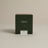 Dark green box labeled ‘FORGRAVE Fine Tea Leaves and Tisanes, 002 Black Blend Bright Side on a beige background.