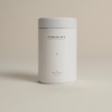 White tea canister labeled ‘003 Boy's Club Black Blend’ on a beige background.