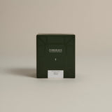 Dark green box labeled ‘FORGRAVE Fine Tea Leaves and Tisanes, 003 Black Blend Boy's Club on a beige background.