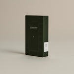 Dark green box of ‘FORGRAVE Fine Tea Leaves and Tisanes, 003 Boy's Club’ with minimalist design on a beige background.
