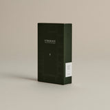 Dark green box of ‘FORGRAVE Fine Tea Leaves and Tisanes, 003 Boy's Club’ with minimalist design on a beige background.