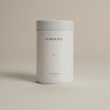 White tea canister labeled ‘004 Avant Garden White Blend’ on a beige background.