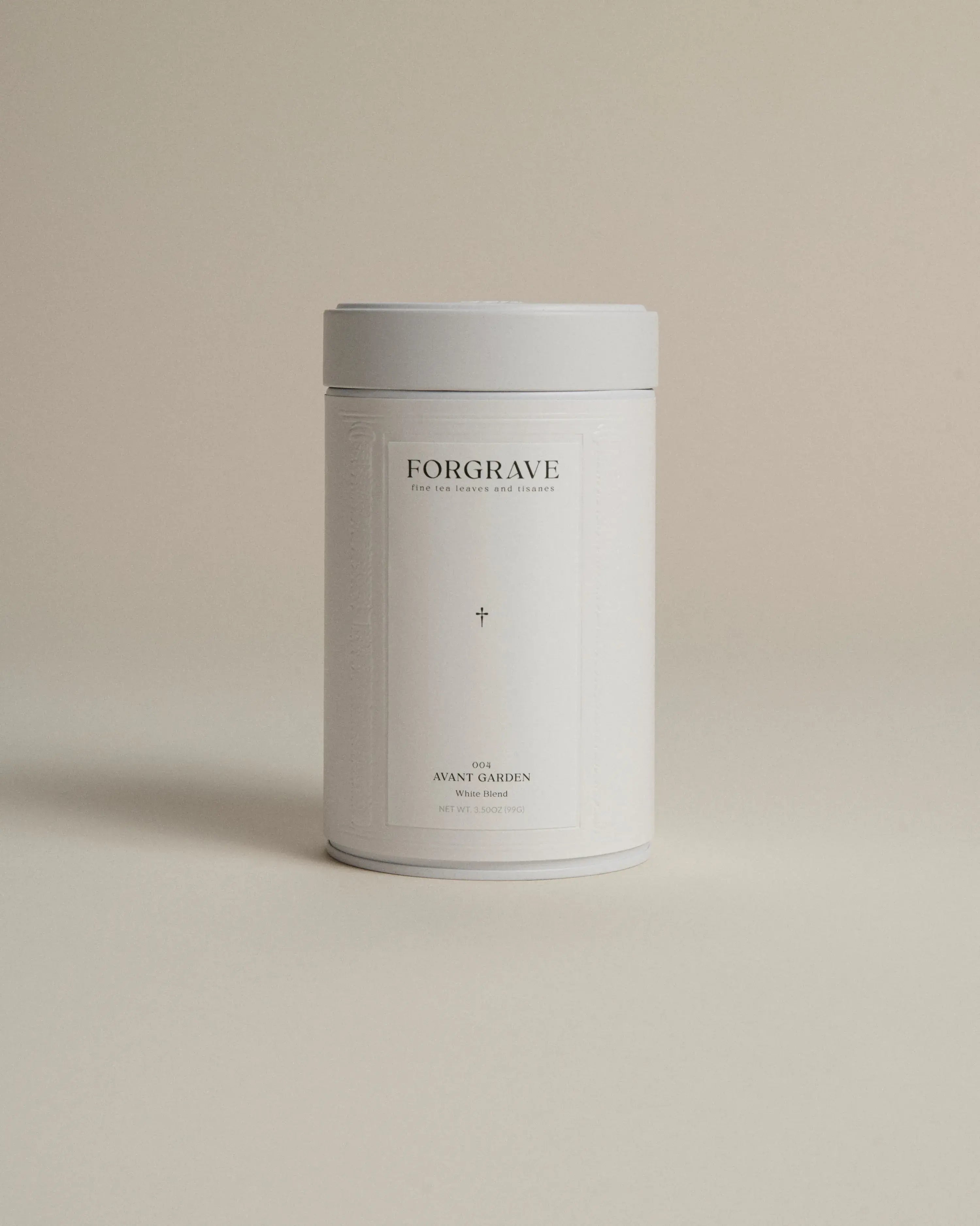 White tea canister labeled ‘004 Avant Garden White Blend’ on a beige background.