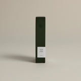 Minimalist dark green box labeled ‘004 Avant Garden – Focus’ by FORGRAVE, standing upright on a beige background.