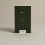 Dark green box labeled ‘FORGRAVE Fine Tea Leaves and Tisanes, 004 White Blend Avant Garden on a beige background.