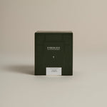 Dark green box labeled ‘FORGRAVE Fine Tea Leaves and Tisanes, 004 White Blend Avant Garden on a beige background.