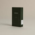 Dark green box of ‘FORGRAVE Fine Tea Leaves and Tisanes, 004 Avant Garden’ with minimalist design on a beige background.