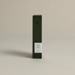 Minimalist dark green box labeled ‘005 Mint Mantra – Calm’ by FORGRAVE, standing upright on a beige background.