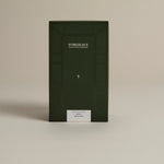 Dark green box labeled ‘FORGRAVE Fine Tea Leaves and Tisanes, 005 Herbal Blend Mint Mantra on a beige background.