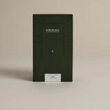 Dark green box labeled ‘FORGRAVE Fine Tea Leaves and Tisanes, 005 Herbal Blend Mint Mantra on a beige background.