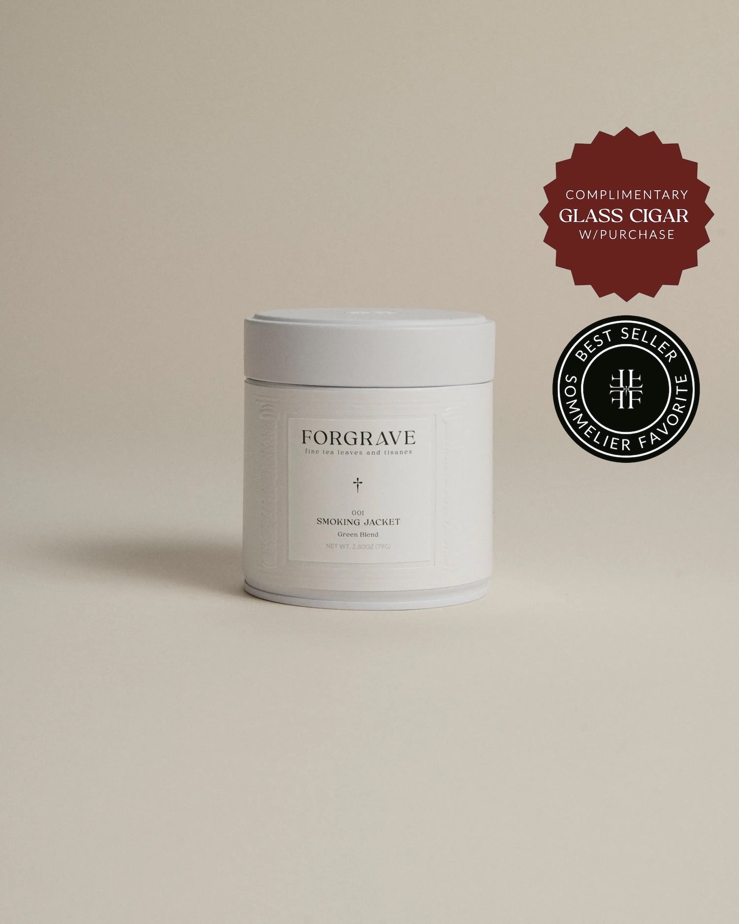 White tea canister labeled ‘001 Smoking Jacket Green Blend’ on a beige background.