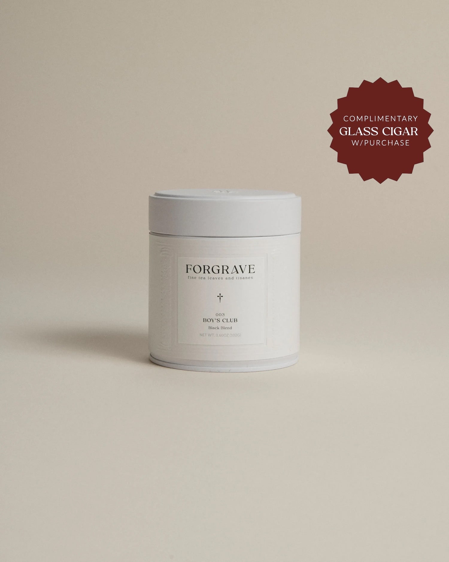 White tea canister labeled ‘003 Boy's Club Black Blend’ on a beige background.