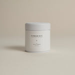 White tea canister labeled ‘004 Avant Garden White Blend’ on a beige background.