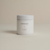 White tea canister labeled ‘005 Mint Mantra Herbal Blend’ on a beige background.