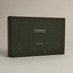Minimalist dark green ‘FORGRAVE Discovery Set’ box with fine tea branding on a beige background.