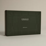 Minimalist dark green ‘FORGRAVE Discovery Set’ box with fine tea branding on a beige background.