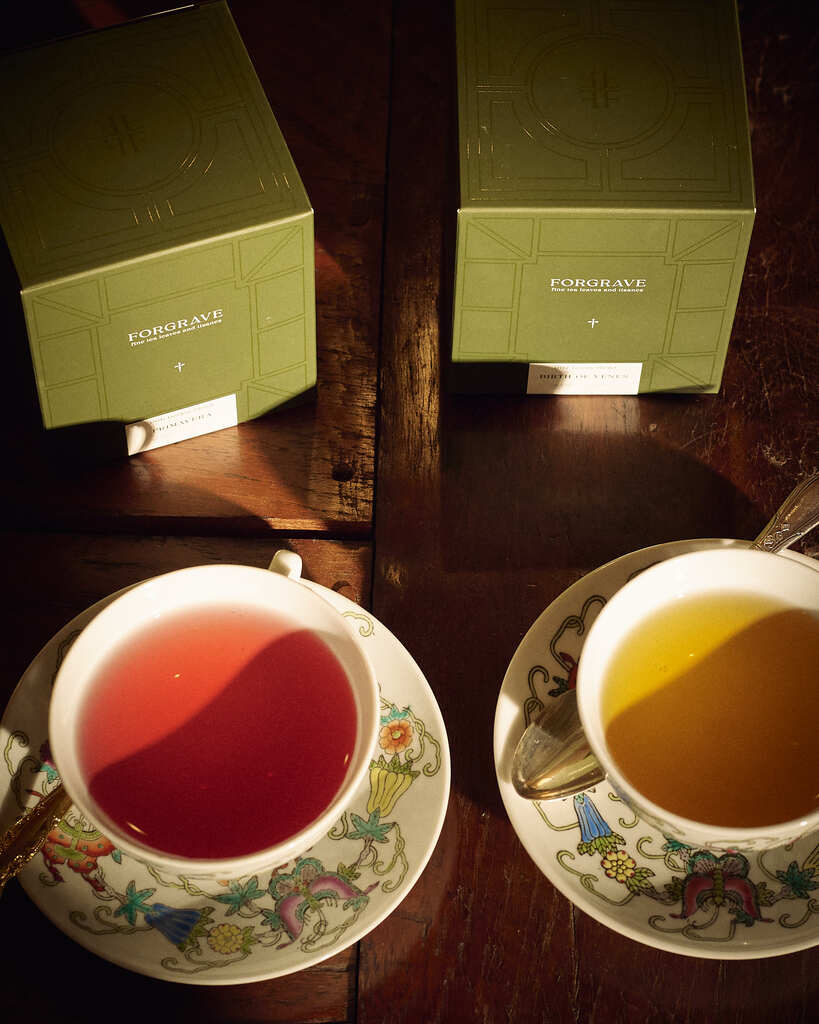 Forgrave Botticelli Duo brewed in vintage porcelain, 006 Primavera in pink hibiscus liquor and 007 Birth of Venus in amber green tea, with sage Forgrave caddies above